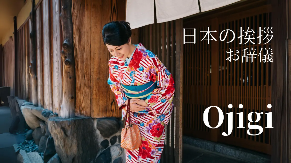 A woman wearing a kimono bowing